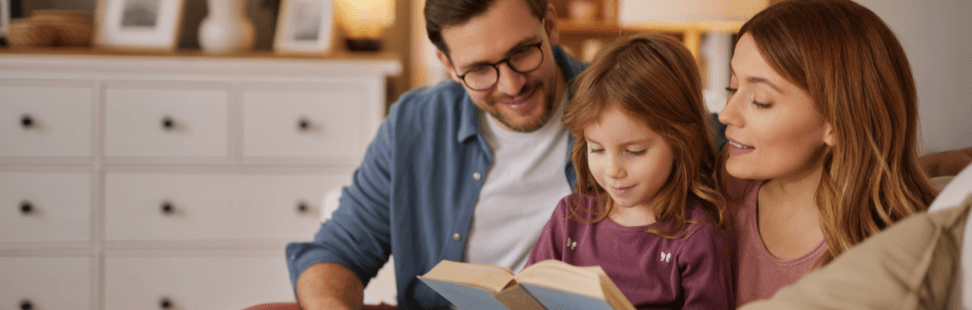 Family reading a book together.png