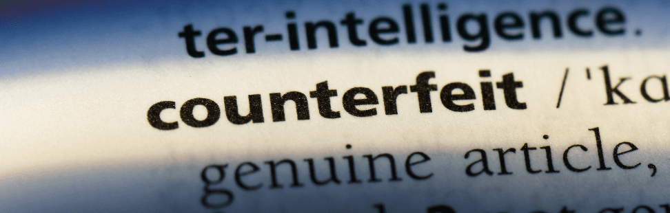 A picture of the word counterfeit in a dictionary.png