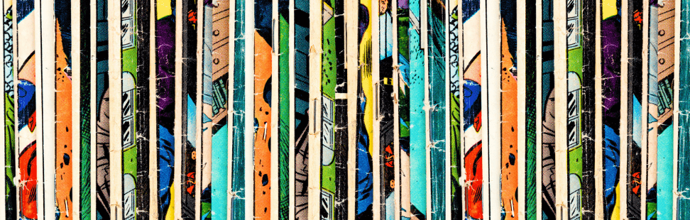 Multiple comics all stacked on a shelf.png