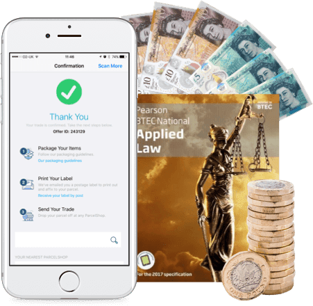 Phone showing trade confirmation screen, UK banknotes, coins and a BTEC Applied Law textbook