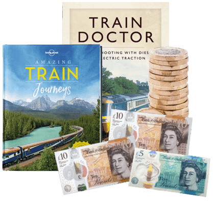 Train books 'Amazing Train Journeys' and 'Train Doctor' with UK banknotes and pound coins, cash for train books