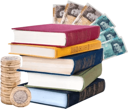 Stack of books with British banknotes fanned behind and a pile of pound coins beside it